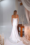 Fitted bridal gown with elegant draping