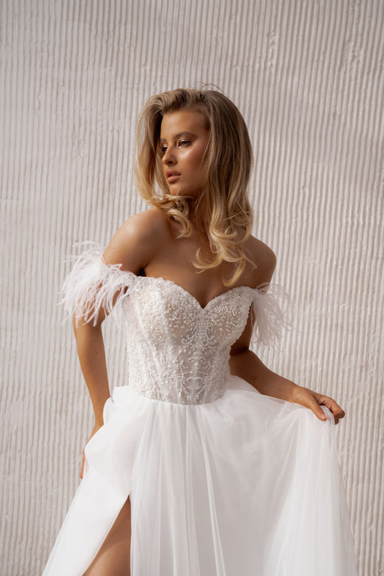 Lace and feather bridal gown