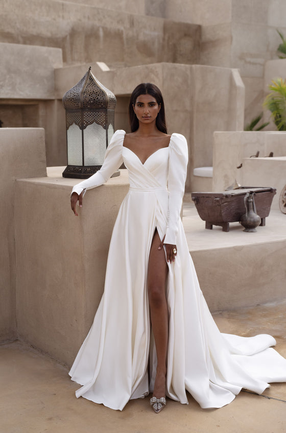 Long sleeve wedding dress with subtleslit