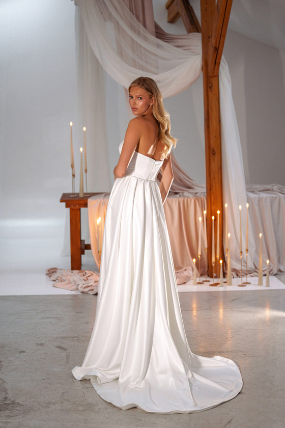 Satin fitted wedding dress with draped waist