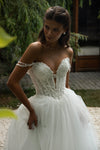 Tulle wedding gown with lace straps