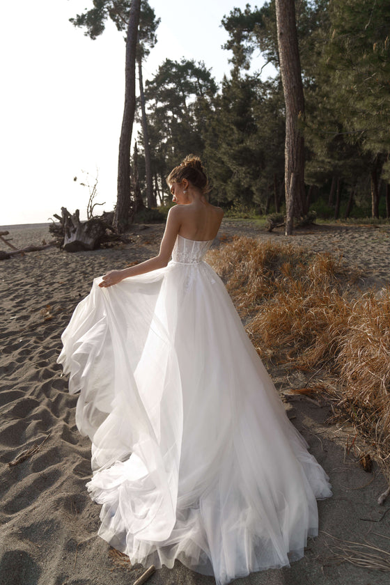 sleek satin strapless corset wedding dress with split